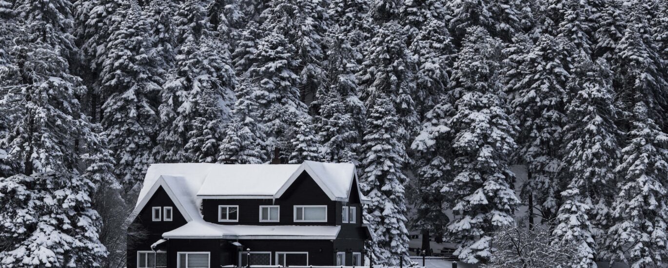 House surrounded by winter weather - we offer winterizing services in southwest Michigan